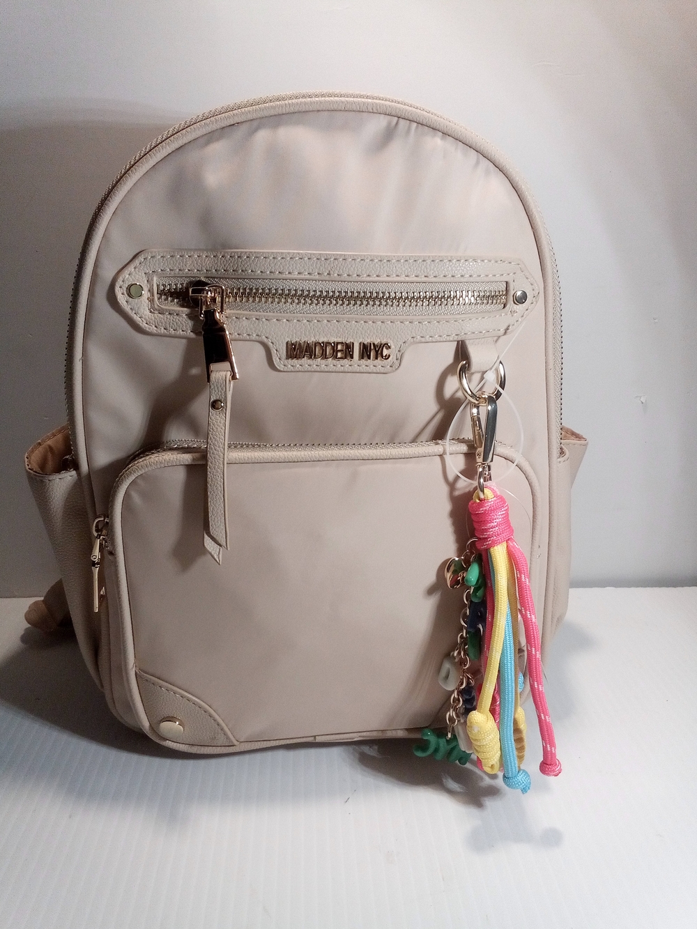 Madden NYC Backpack Beige One Size Zip Closure Adjustable Strap Keychain Charm